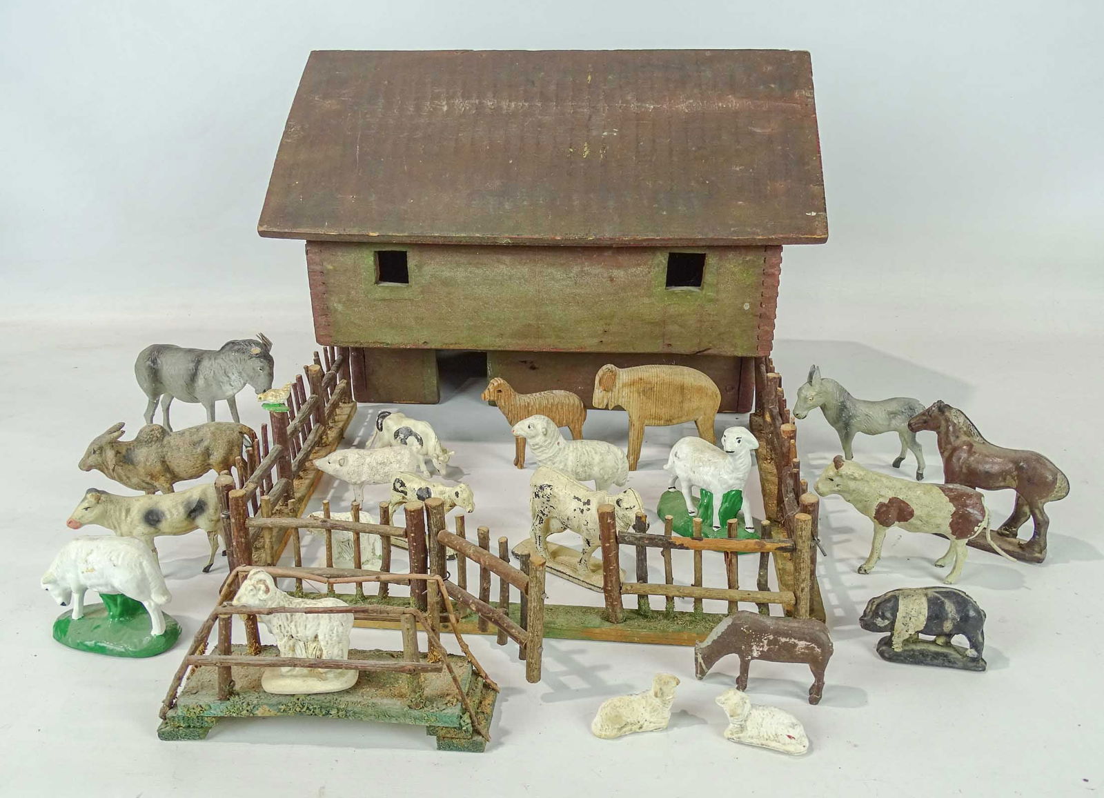 Folk Art Barn: Folk art barn with various carved and cast animals. Barn 15 1/2" x 11 1/4", 12" Ht..