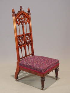 Gothic Chair: 19th c. carved Gothic chair with upholstered seat. Raised on casters. 16" seat Ht., 49 1/2" overall Ht..