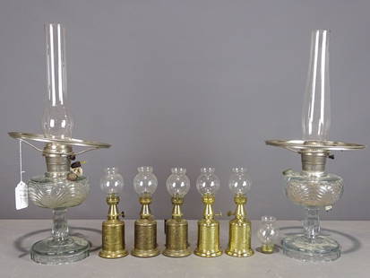Misc. Lighting Lot: Misc. lighting lot including (2) clear glass kerosene electrified lamps, (5) brass oil lamps, "Lampe Feutree Abeille" French table lamp.