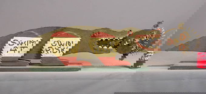 Folk Art Sign: Folk art wood and metal sign "SWIM AT YOUR OWN RISK". 51" W., 12" Ht..