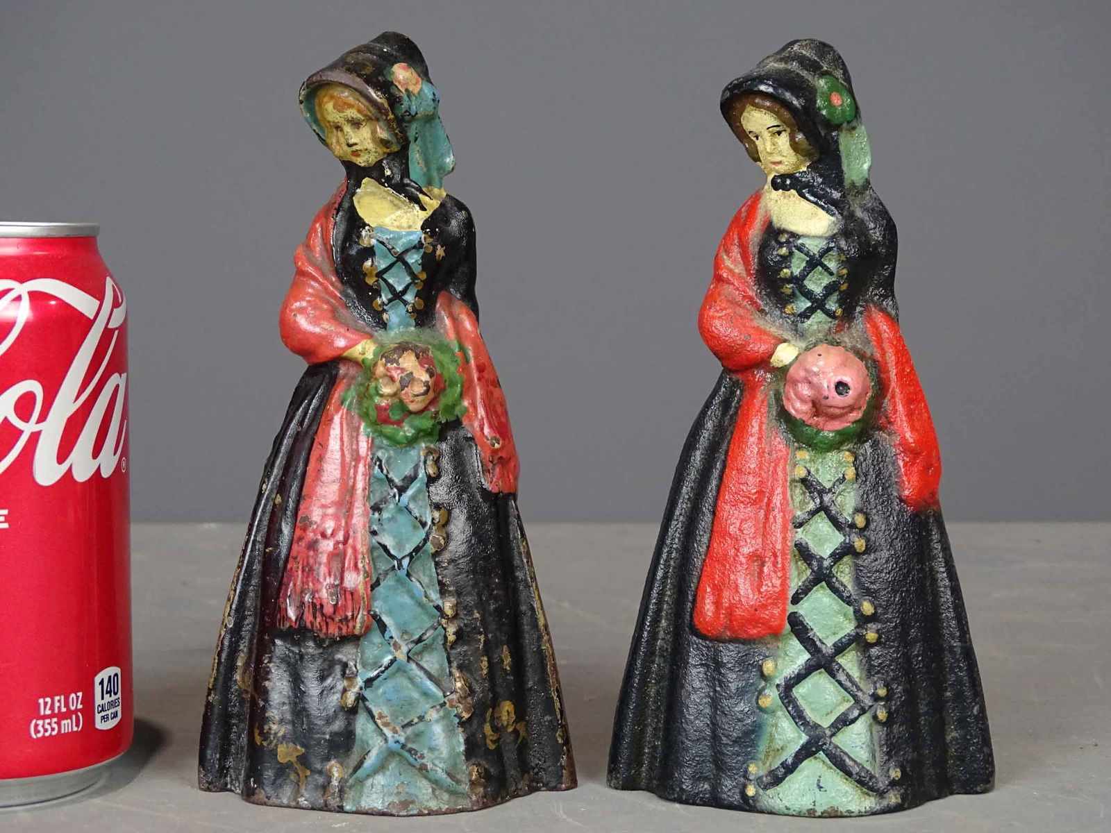 Doorstops: Pair of cast iron doorstops "Little Southern Belle". 6 1/2" Ht.. National Foundry.