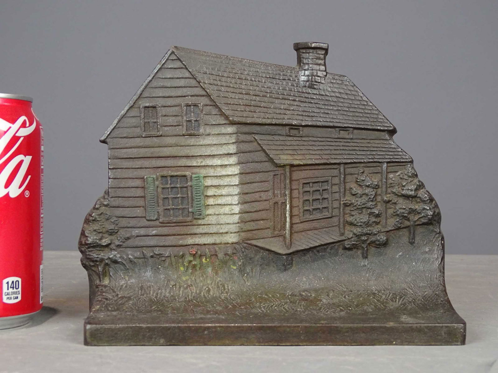 Edgar Allen Poe Cabin Doorstop: Cast iron Edgar Allen Poe Cabin doorstop. 5 7/8" Ht.. Bradley and Hubbard. With rubber bumpers.