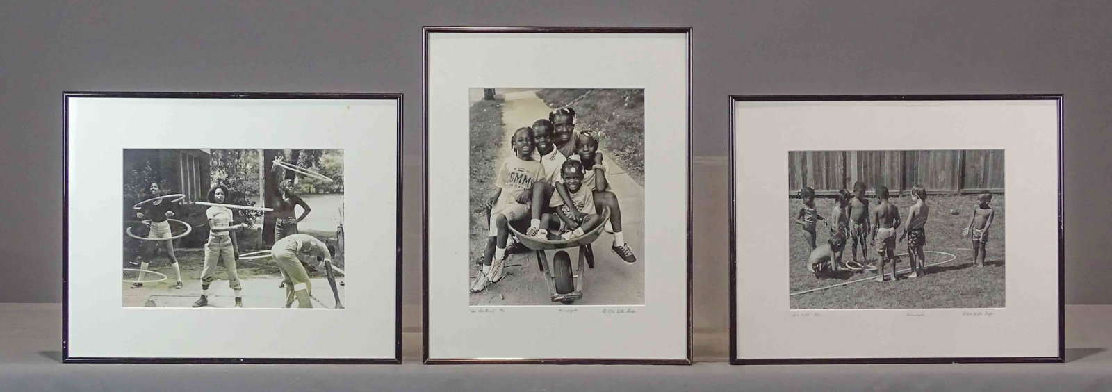 Walter Griffin Photographs: Lot (3) Walter Griffin photographs. 8/76 Chicago "Hoola Hoops", 8/98 Minneapolis "In the Barrel", 8/89 Minneapolist "It's Cold". Frames 16" x 20".