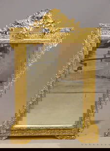 Continental Wall Mirror: Gilded and carved Continental wall mirror. 40" x 27".