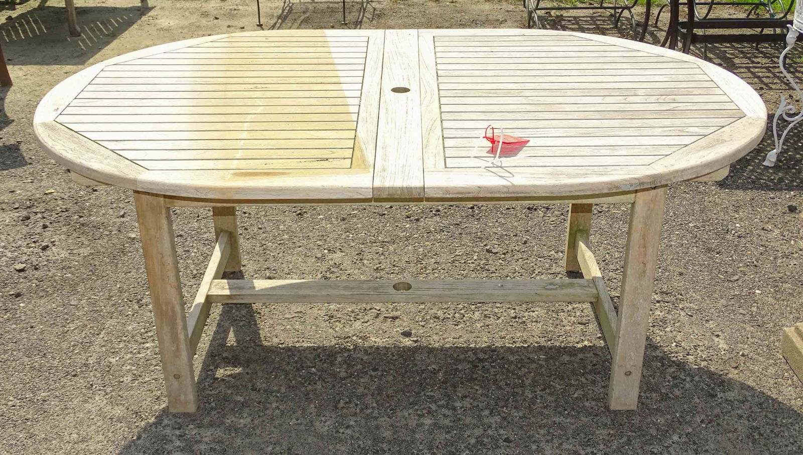 Teak Table: Teak table with (2) leaves marked "Jordan". 29" Ht., overall 95" x 47".
