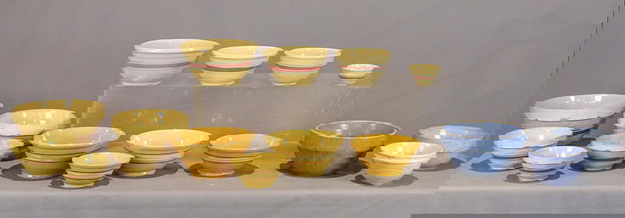 Yelloware Bowl Collection: Yelloware bowl collection: Nest (5) brown band bowls (largest 14" dia.); nest (4) four band bowls (largest 12 1/2" dia.); three band bowls (largest 12 1/4" dia.); (3) blue bowls (largest 12 1/2" dia.)