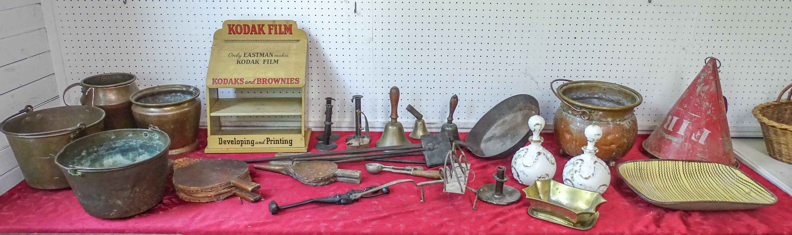 Misc. Lot: Misc. lot including iron pan (43" L.), copper pots (largest 10" D., 9 1/2" Ht.), Kodak Films display (15" x 8" x 15"), tin fire bucket (16" Ht.), (2) milk glass Barber bottles (10" Ht.), redware dish