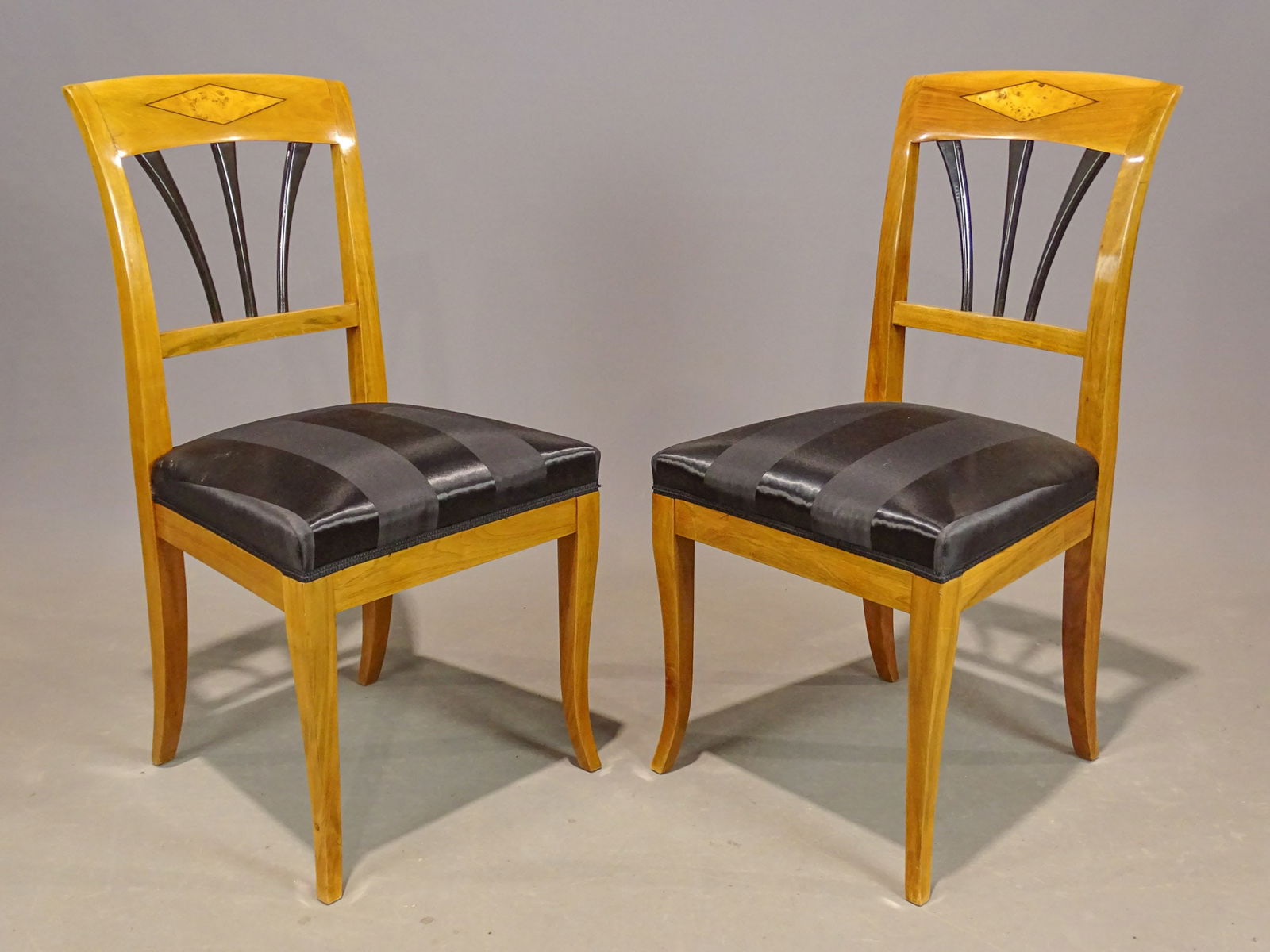 Pair Biedermeir Chairs: Pair of Biedermeir chairs with upholstered seats. 19" seat Ht., 36" overall Ht..