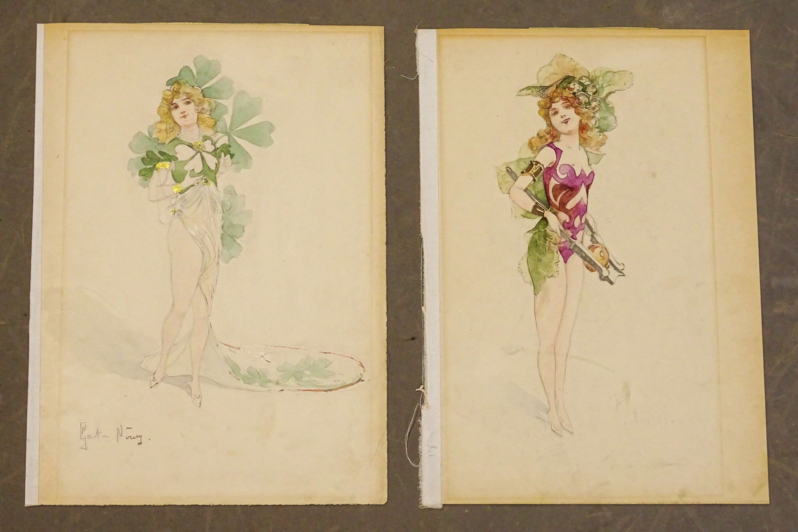 French Costume Design Watercolor Pair: Pair of original watercolor costume designs, by Gaston Noury (1866-1936). Each of a young women in colorful whimsical outfit. One outfit features four-leaf clover.. 12 1/2" x 9".