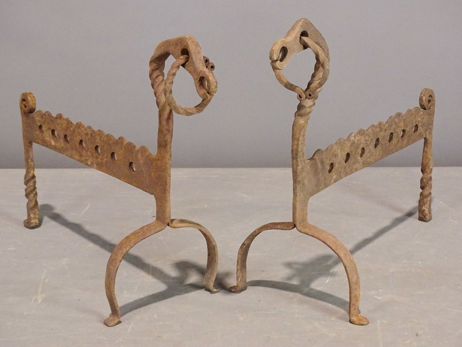 Fire Dogs: Pair of Dragon head iron fire dogs. 12" Ht., 12 1/2" L..