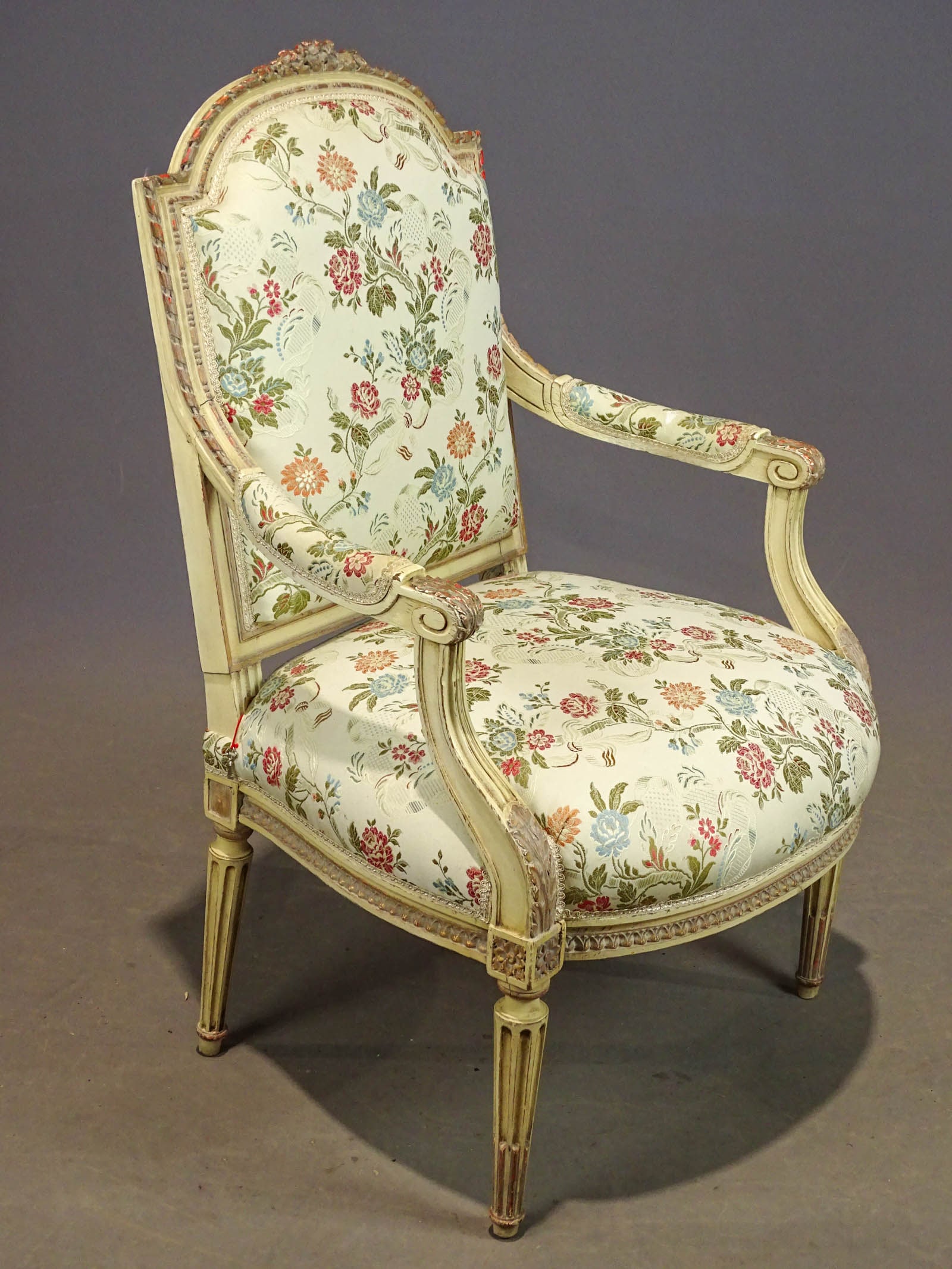 French Armchair: French carved and upholstered armchair. 17" seat Ht., 39" overall Ht..