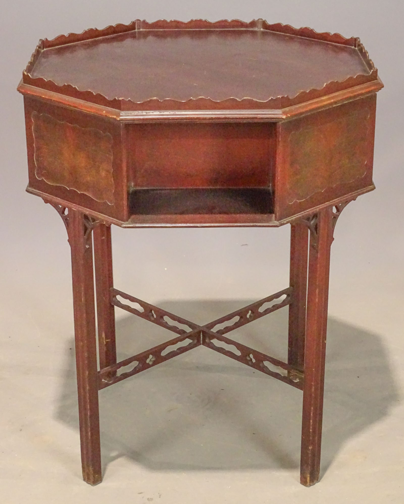 Mahogany Octagonal Stand: Mahogany Chippendale style carved octagonal stand. Celluloid label underside "Hampton Shops…New York". 24" D., 30" Ht..