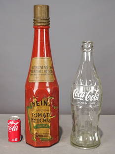 Advertising Bottles: Two large glass advertising bottles including: Coca Cola (20" Ht.), and Heinz (26 1/2" Ht.).