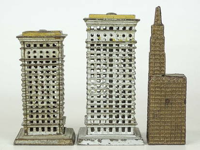 Bank Lot: Lot (3) cast iron still banks including: (3) Kenton Buildings. Woolworth (5 3/4" Ht.), (2) Hi-Rise (4 1/2" and 5 1/2" Ht.).
