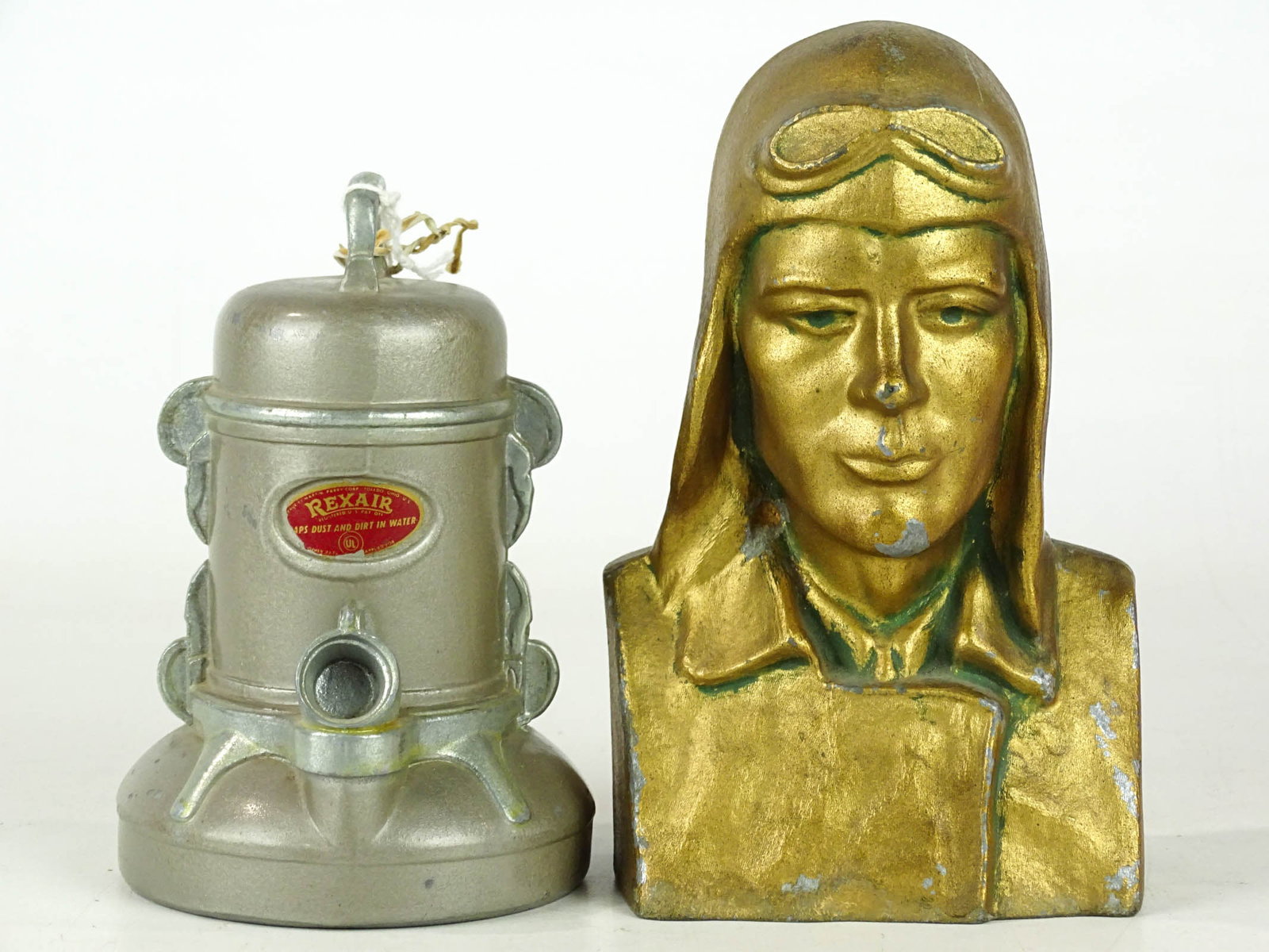 Bank Lot: Bank lot including Repair Vacuum Cleaner bank (Banrithco, C. 1950's, 5" Ht.), Lindy bank (aluminum, 6 1/2" Ht., missing bottom).