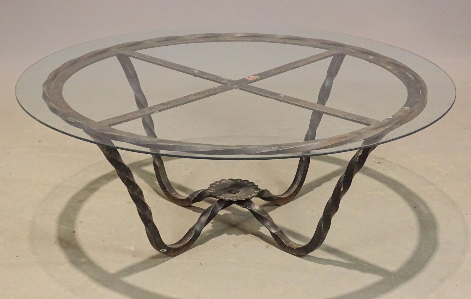 Coffee Table: Wrought iron glass top coffee table. 41 1/2" D., 16" Ht..