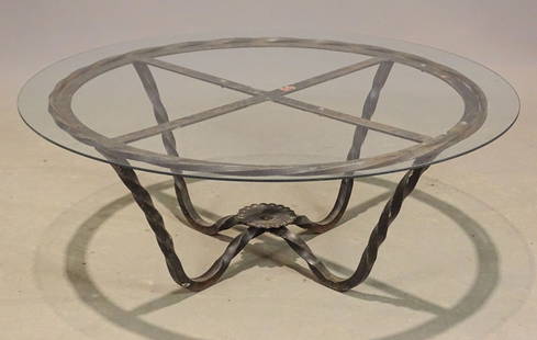 Coffee Table: Wrought iron glass top coffee table. 41 1/2" D., 16" Ht..