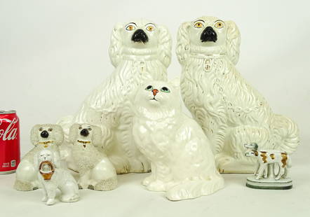 Staffordshire Lot: Lot including pair 19th c. Spaniels (9" W., 12" Ht.), (3) Spaniels (4" and 4 1/2" Ht.), Beswick cat (9" Ht.), dogs figurine (3" L., 3" Ht.).