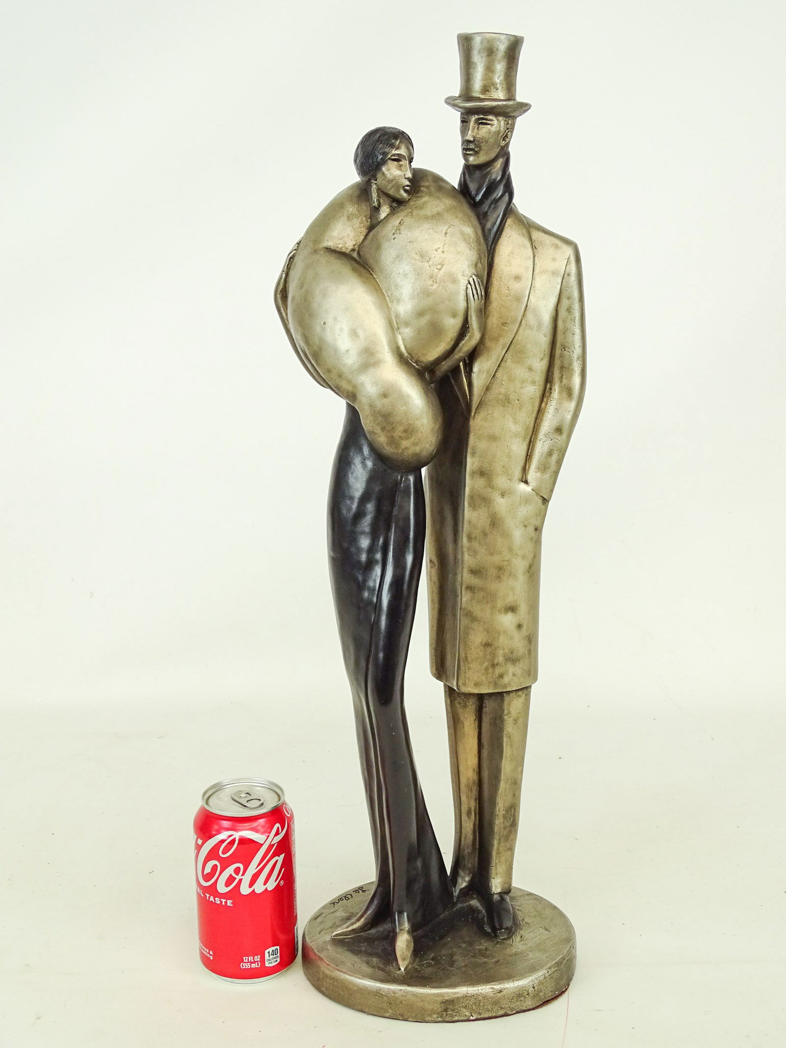 Composition Sculpture: Composition sculpture of man and woman. 24" Ht.. Marked Austin Prod. Inc. 1986.