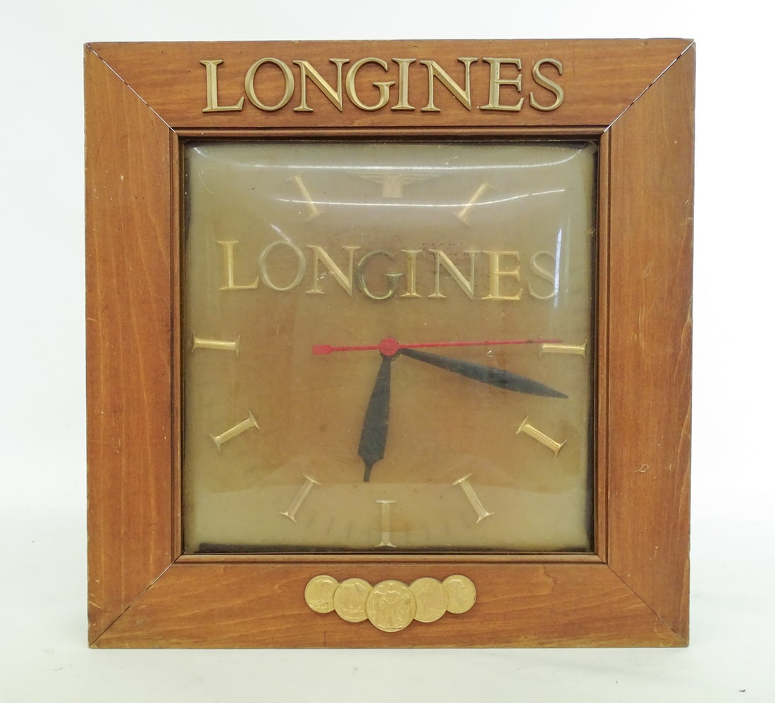 Longines Clock: Vintage Longines wall clock. Appears to run. 18" x 18".