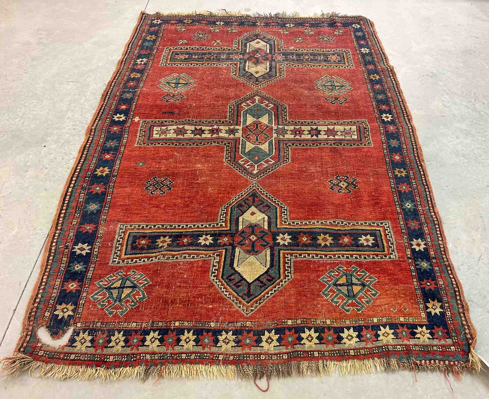 Oriental Rug: Oriental rug. 57" x 80". As found, hole in one end.