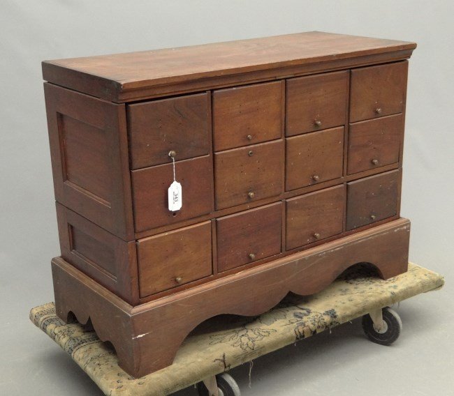 Apothecary Cabinet: C. 1900's 12 drawer apothecary cabinet. 38 1/2" W 17" D 22" Ht.