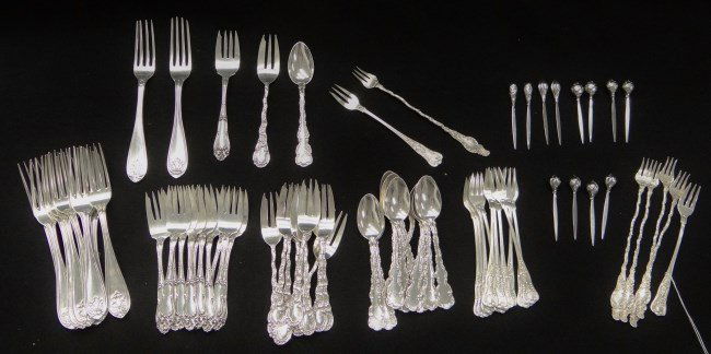 Sterling Silver Lot: Lot misc. sterling silver flatwear including 12 6" salad forks, 12 7 1/2" forks, five 7 1/4" pickel forks, 12 6" pickel forks, 12 6 1/4" salad forks, 12 5 3/4" spoons, 12 3" picks. 2342 grams.