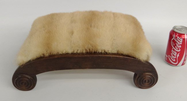 Footstool: Empire style fur covered footstool. 16" W 4" Ht.