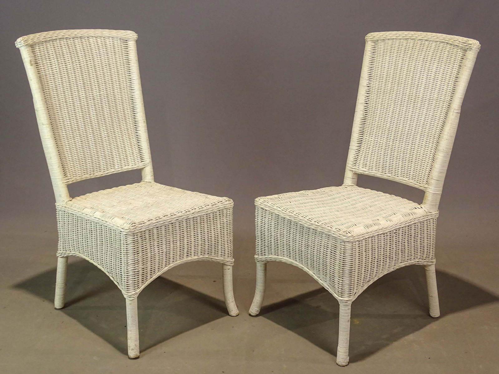 Wicker Chairs: Pair of wicker chairs. 18" seat Ht., 38 1/2" overall Ht..