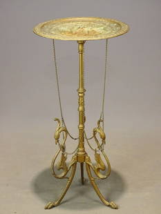 Victorian Metal Table: Victorian cast metal calling card table, with griffin decoration. 31" x 15"