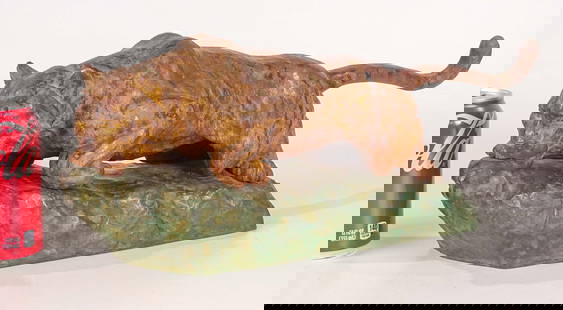 Feline Sculpture: Bronze sculpture, prowling feline, marked "Japan". 20" x 7" Ht.