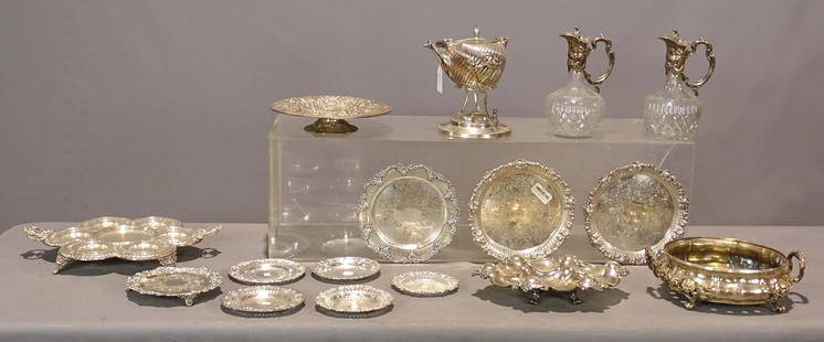 Silver Plate Lot: Pair of glass and silver pitchers (10" Ht.), segmented handled tray (18" wide), coffee pot on stand, warming dish (10" D.), Repoussé floral bowl (11 3/4" D.), oval condiment tray (13 1/2" x 9 1/2"),