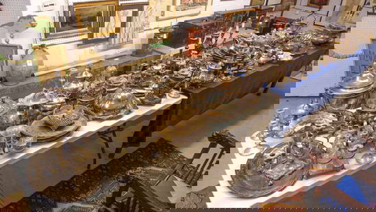 Large Silverplate Lot: Large table lot of early silverplate including trays, pitchers, candlesticks etc.. Over 70 pieces. Largest tray 27" L..
