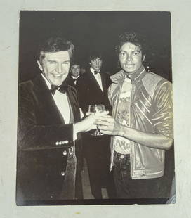 Ron Galella Photograph of Michael Jackson: Ron Galella (1931-2022). Original press photo of Liberace and Michael Jackson. Galella stamps verso.