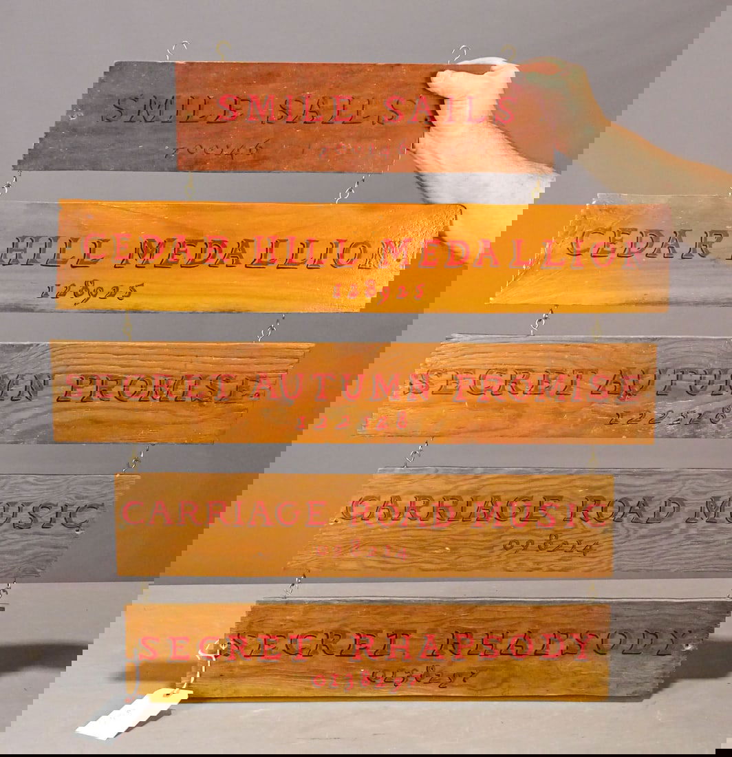 Trade Sign: Vintage painted wooden (5) part trade sign "SMILES SAILS / CEDAR HILL MEDALLION / SECRET AUTUMN PROMISE / CARRIAGE ROAD MUSIC / SECRET RHAPSODY". 29" x 31".