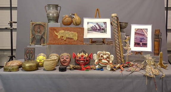 Indian and Indonesian Lot: Indian and Indonesian lot including: Lot of Indian metalware from Rajastan, basket from Omo River Valley, SW Ethiopia, Ceramic decorated “discs" on shelf (below the photo of a row of stilt houses) a