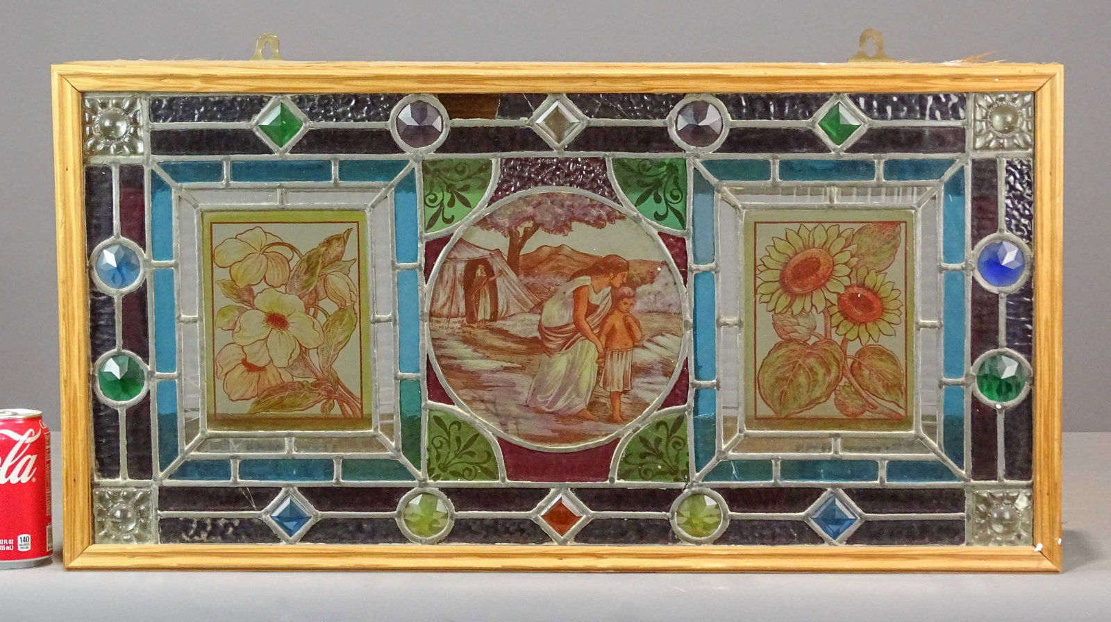 Leaded Glass Window: Stained and leaded glass window in wooden frame. 31" x 5" x 16".