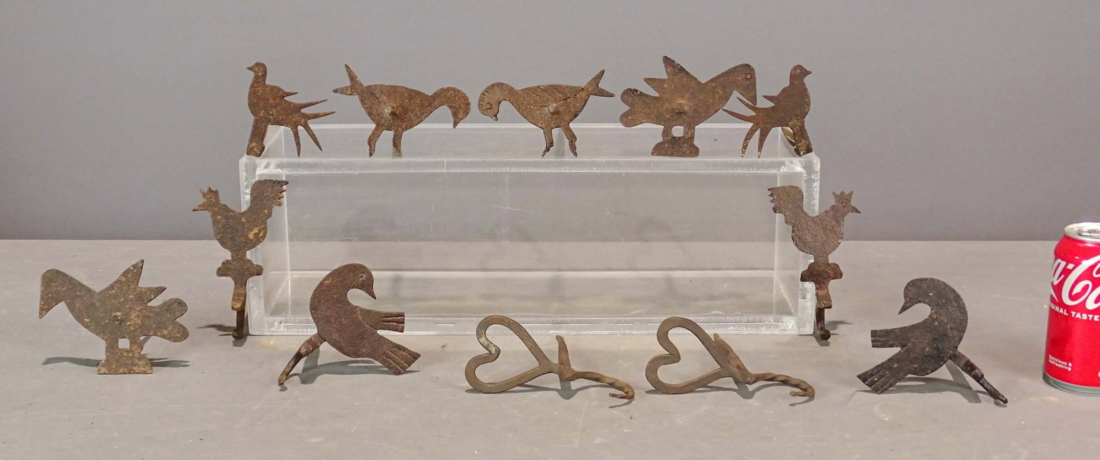 Iron Beam Hooks: Lot (12) early figural iron beam hooks. Largest 5 1/2" L..