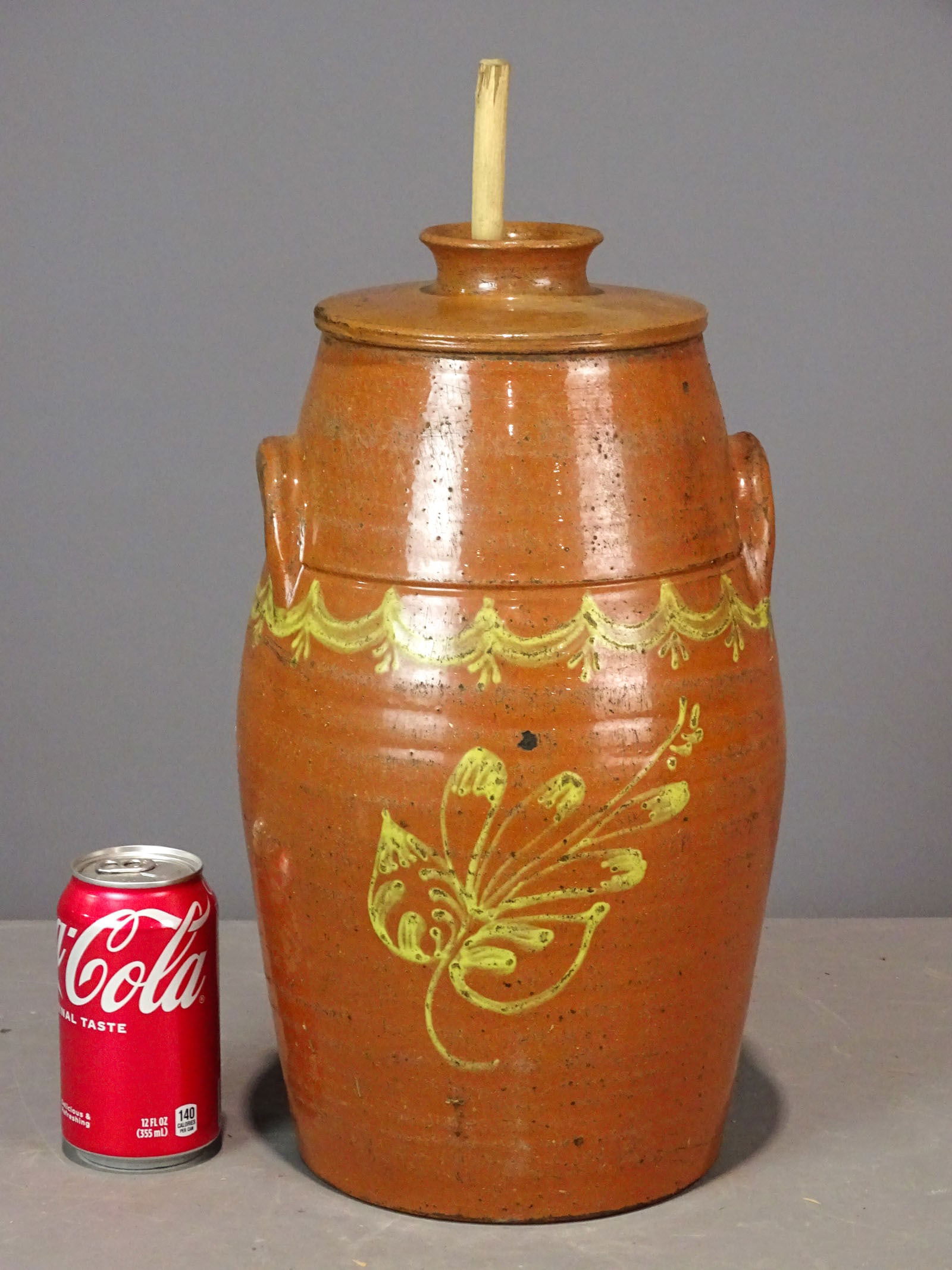 Redware Churn: Redware slip decorated churn (15 1/2" Ht.). With churning stick.