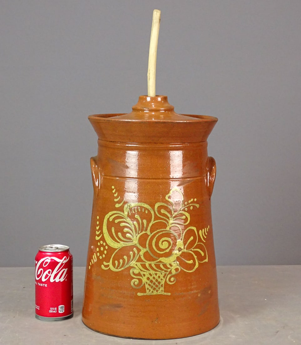 Redware Churn: Redware slip decorated churn (14 1/2" Ht.). With churning stick.