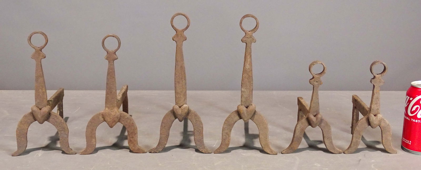 Andirons: Lot (3) sets of diminutive andirons. Largest 10" Ht., 10" D..