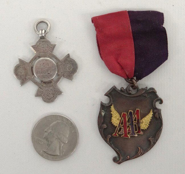 Bicycle Medals: Bicycle Medals including one American and one English. American is marked "AAA" with golden wings. Each "A" is individually enameled. Original black & red ribbon with pin clasp. Engraved on reverse: 2