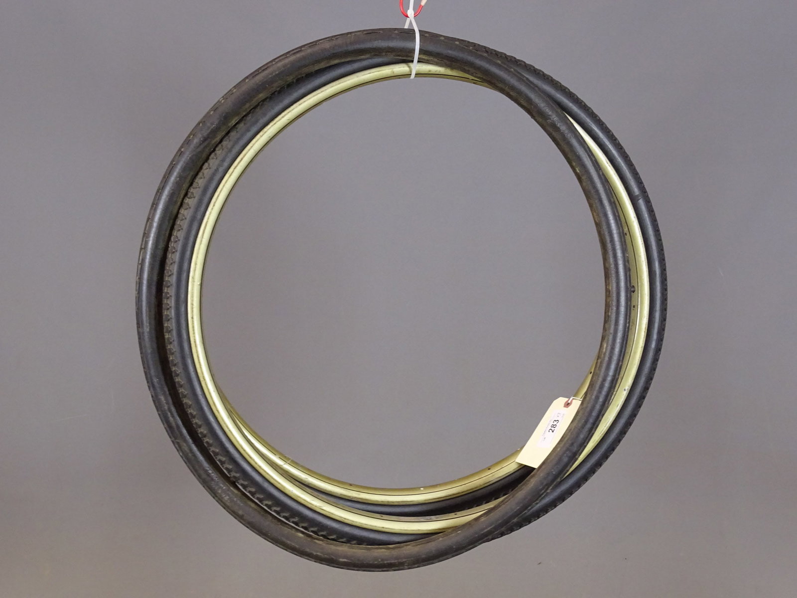 Lobdell Rims: Pair of Lobdell 26" wooden safety rims with tires (Universal Tire Company). Along with NOS tire. Dave Walker Collection.