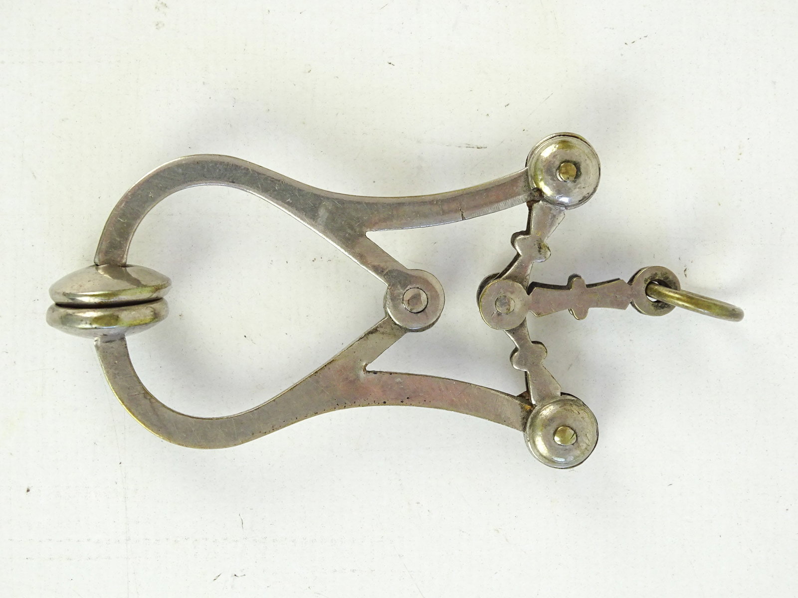 Skirt Lifter: Victorian skirt lifter. 3" L.. Good condition. Dave Walker Collection.