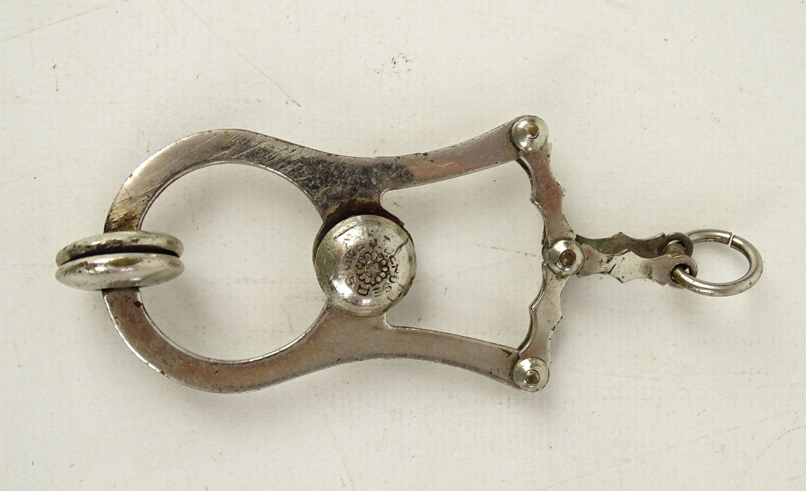 Skirt Lifter: Victorian skirt lifter. Marked Depose Paris. Good condition. 4" L.. Dave Walker Collection.