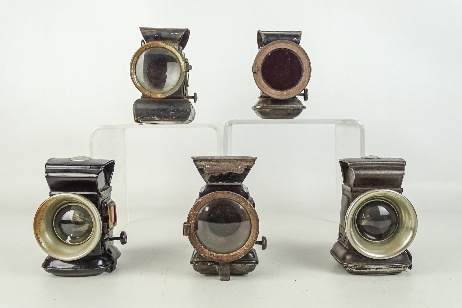 Bicycle Lamp Lot: Bicycle lamp lot including: black box lamps, Jos. Lucas, Sadar. All retain brackets. 41/2" x 5". Fair-Good condition. Provenance: John Bergin Collection, Illinois.