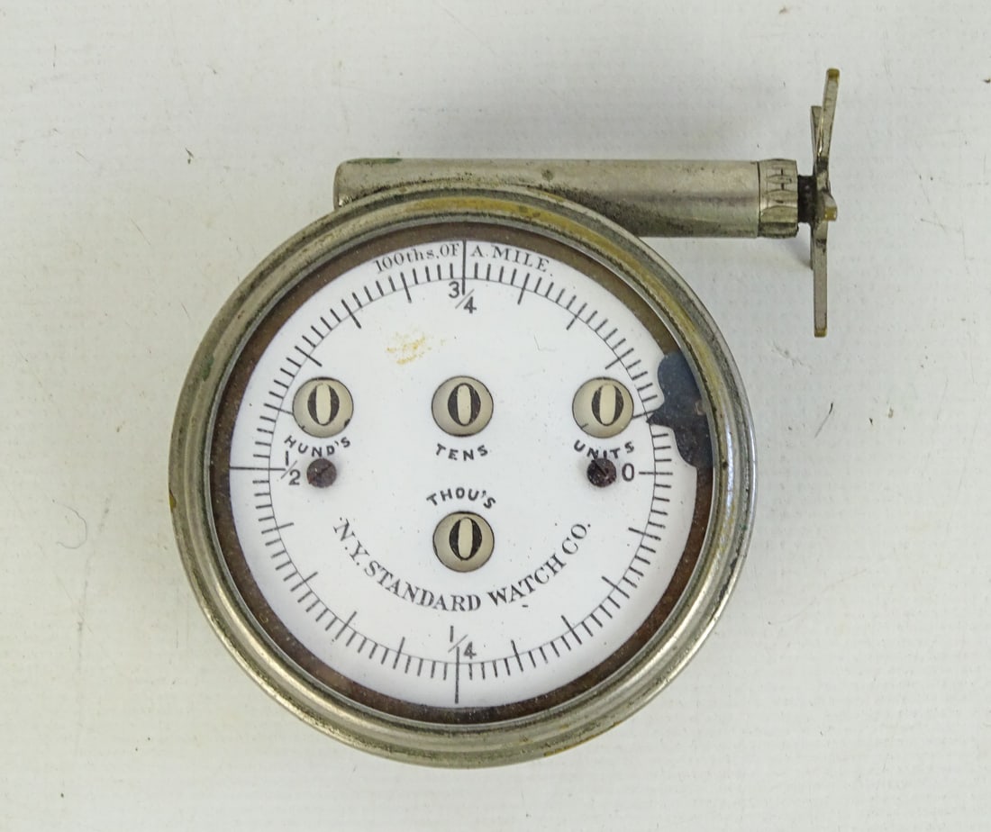 Cyclometer: 26" Thou's N.Y. Standard Watch Co. cyclometer. 2" x 2 1/2". Good condition.