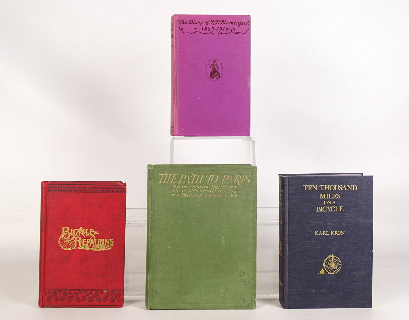 Book Lot: Book lot including: Ten Thousand Miles on a Bicycle (Kron), Bicycle Repairing (S.D.V. Burr), The Path To Paris (Frank Rutter), The Diary of RD Blumenfeld 1883-1914. Fair-Good condition. Steve Stevens 
