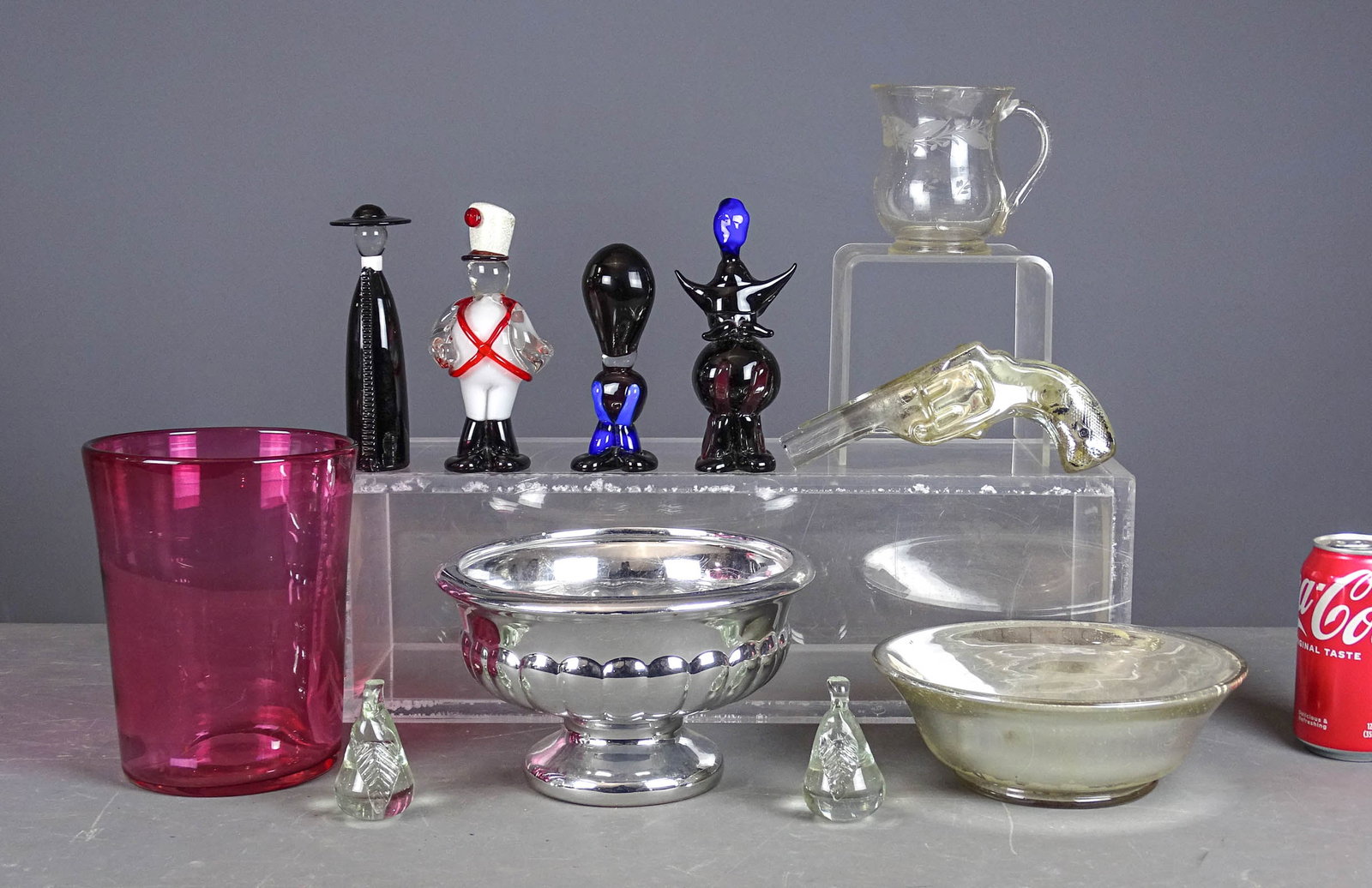 Misc. Lot: Lot including candy container gun (7" L.), (2) Mercury glass bowls (8" D.), cranberry glass vase (7 1/2" Ht.), etched pitcher (4" Ht.), (2) glass paperweights, (4) Murano glass figures (6" Ht.).