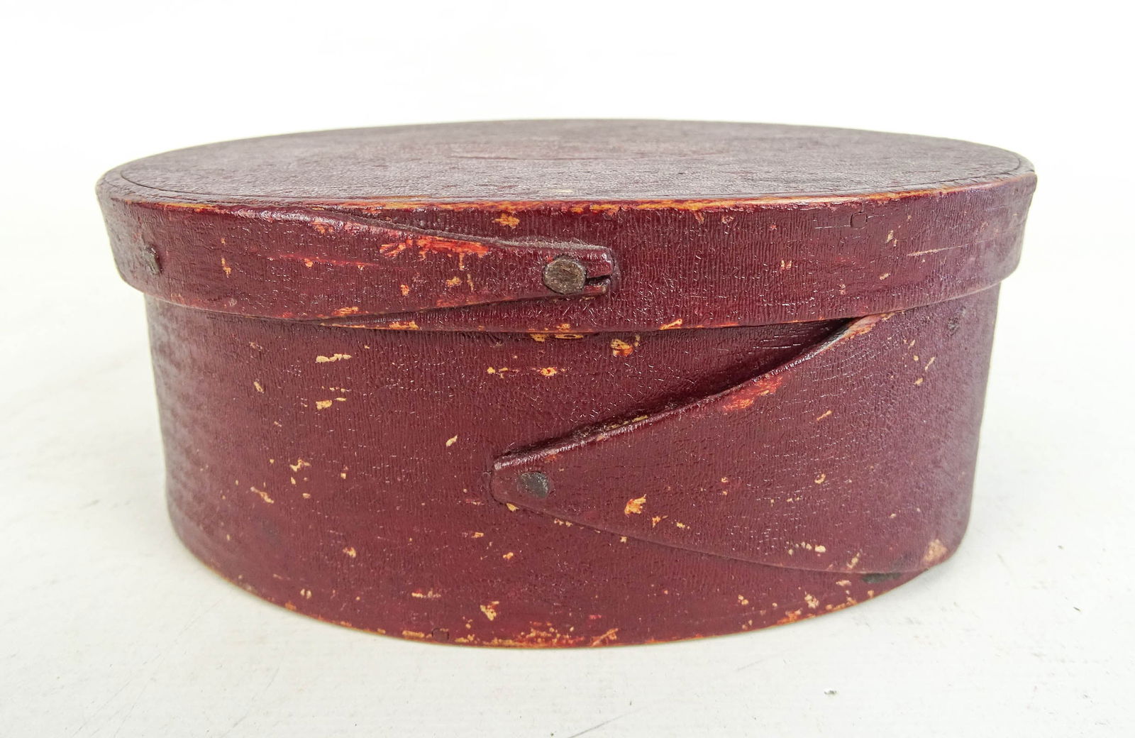 19th c. Shaker Oval Box: 19th c. Shaker oval box in old red paint. 6" x 4 1/2" x 2 1/2".